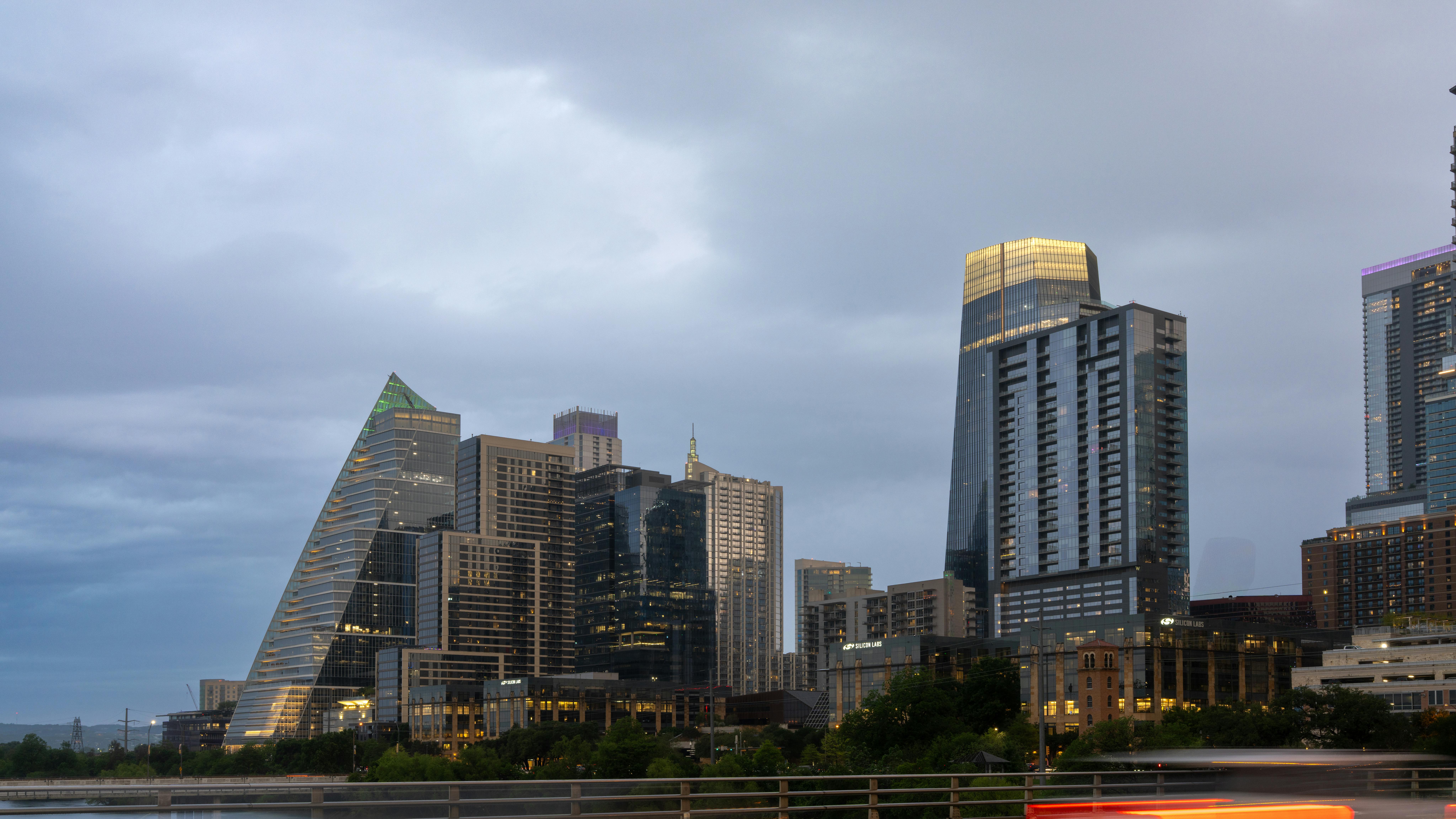 Austin downtown skyline at dusk under an overcast sky.