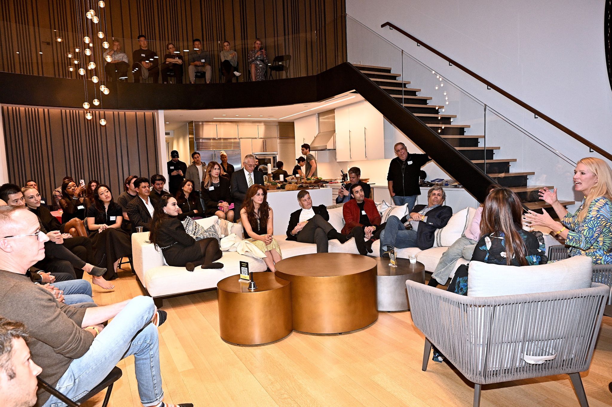 Investors gathered around the table at an Astronomic investor dinner in a private home.